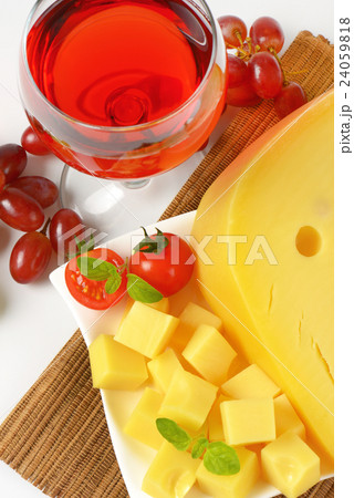Swiss cheese, red wine and fresh grapes 24059818