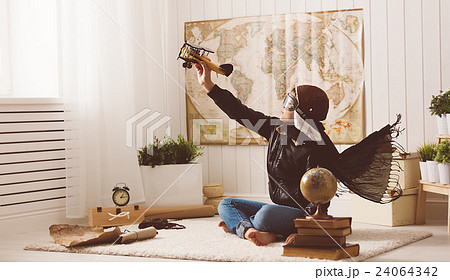 child boy teenager dreams of becoming pilot and  aviator traveli 24064342
