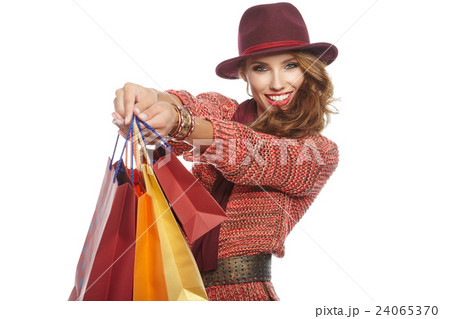 Autumn woman with shopping bags. Studio shoot 24065370