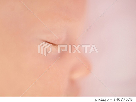 Closeup of delicate baby's eye with tiny lashes 24077679