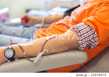 Blood donor at donation. Blood donor at donation. 24078679