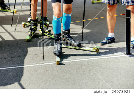 group of men athletes on ski-skaters group of men athletes on ski-skaters 24078922