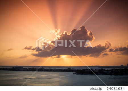 Sunset through clouds 24081084