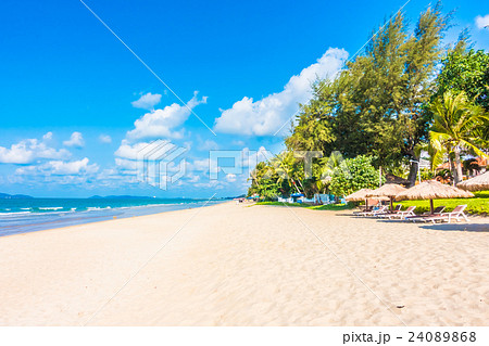 Umbrella and chair on the beach Umbrella and chair on the beach 24089868