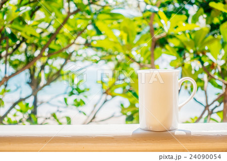 White coffee cup with outdoor view White coffee cup with outdoor view 24090054