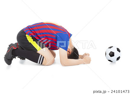 soccer player lose the game and kneel down 24101473