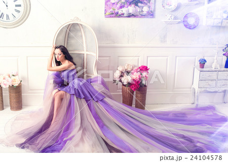 Woman posing in long purple dress 24104578