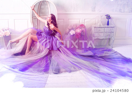 Woman posing in long purple dress 24104580
