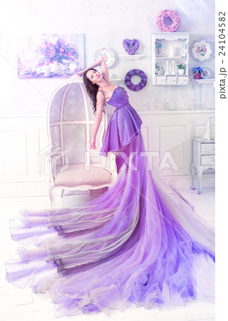 Woman posing in long purple dress Woman posing in long purple dress 24104582