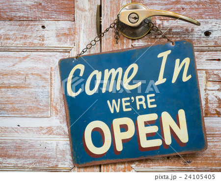 Come In We're Open on the wooden door 24105405