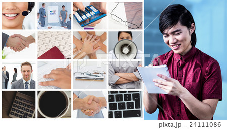 Composite image of smiling hipster takes notes with his smartphone 24111086