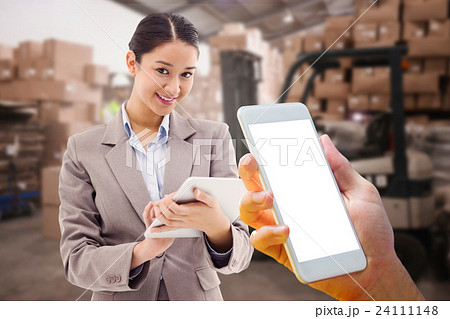 Composite image of hand holding smartphone Composite image of hand holding smartphone 24111148