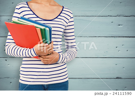 Composite image of mid section of woman holding files 24111590