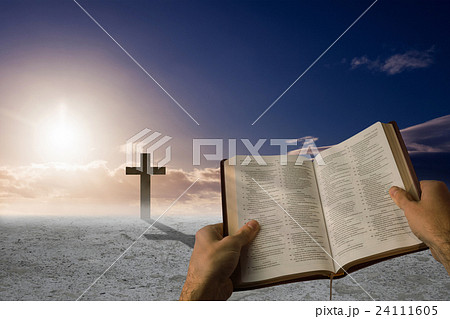 Composite image of man holding a holy bible 24111605
