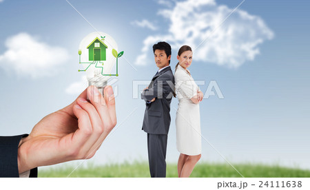 Composite image of portrait of business people standing back-to-back Composite image of portrait of business people standing back-to-back 24111638
