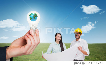 Composite image of casual architecture team working together at desk Composite image of casual architecture team working together at desk 24111740