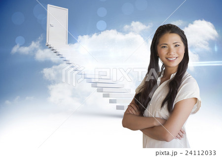 Composite image of casual businesswoman looking at camera with arms crossed 24112033