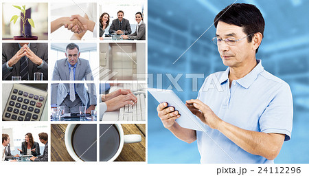 Composite image of man using digital tablet while standing 24112296