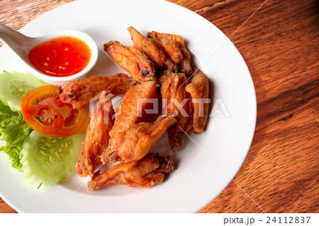 Fried chicken wings with sauce Fried chicken wings with sauce 24112837