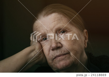 senior woman looking to the camera with sad senior woman looking to the camera with sad 24118669