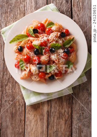Conchiglie with tomato sauce, olives and parmesan Conchiglie with tomato sauce, olives and parmesan 24120651