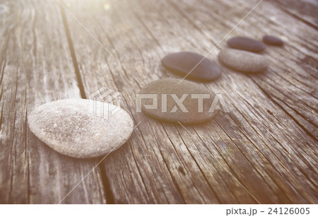 Stones Wooden Table Group of Objects Dawn Concept 24126005