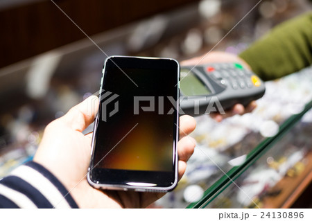 Customer paying with NFC technology 24130896