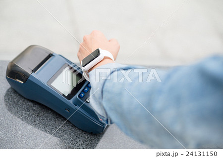 Woman using smart watch for payment Woman using smart watch for payment 24131150