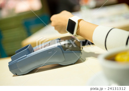 Smartwatch paying on the bill in restaurant Smartwatch paying on the bill in restaurant 24131312