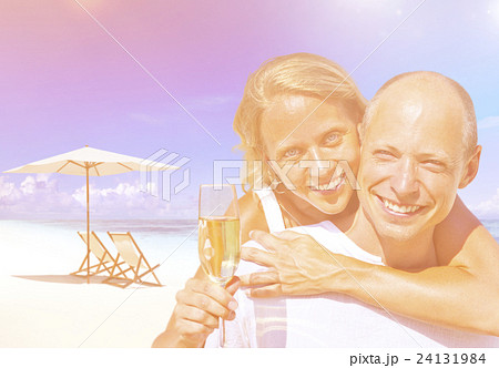 A couple celebrating on the beach 24131984