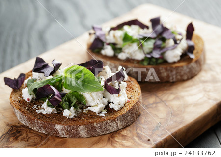 rye sandwich or bruschetta with ricotta, herbs 24133762