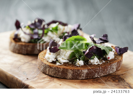 rye sandwich or bruschetta with ricotta, herbs 24133763