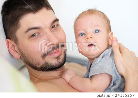 Newborn with his father Newborn with his father 24135257