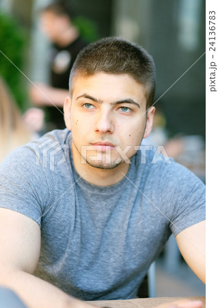 Man in outdoor restaurant 24136783