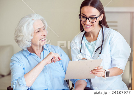 Nurse writing something down Nurse writing something down 24137977