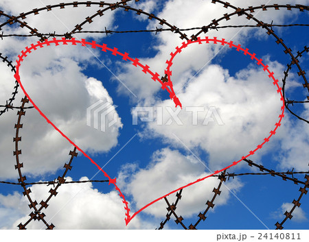 Barbed wire heart on sky background 24140811