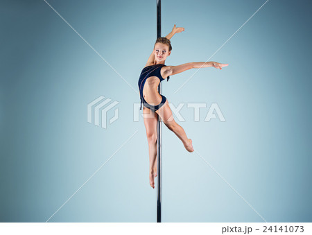 The strong and graceful young girl performing The strong and graceful young girl performing 24141073