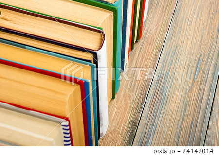 Books on grunge wooden table desk shelf in library Books on grunge wooden table desk shelf in library 24142014