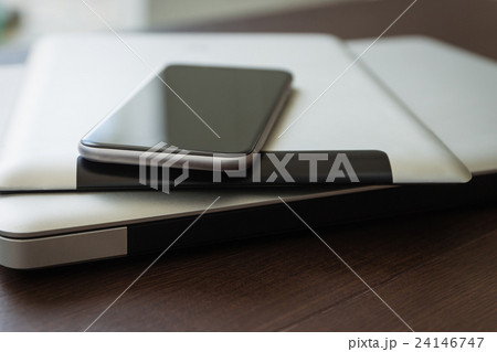 close up phone on tablet and laptop 24146747