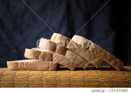 Bread wheat slice on dark background 24147000