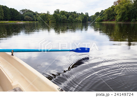 boat trip on the boat with the oars in city pond boat trip on the boat with the oars in city pond 24149724