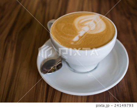 Coffee cup on a wooden table Coffee cup on a wooden table 24149793
