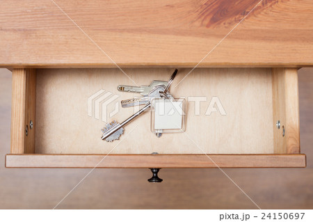 bunch of door keys with keychain in open drawer bunch of door keys with keychain in open drawer 24150697