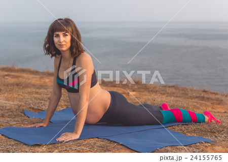 Sportive pregnant girl doing sport outdoors 24155765