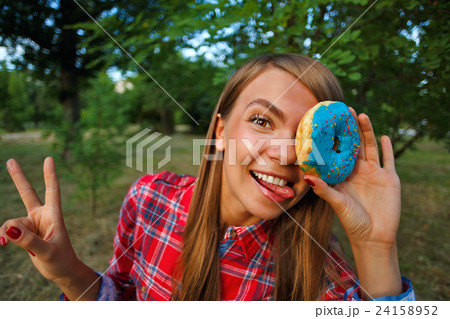 Merry girl and a donut 24158952