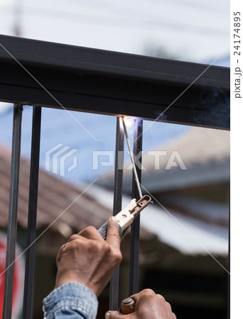 worker welding door frames worker welding door frames 24174895