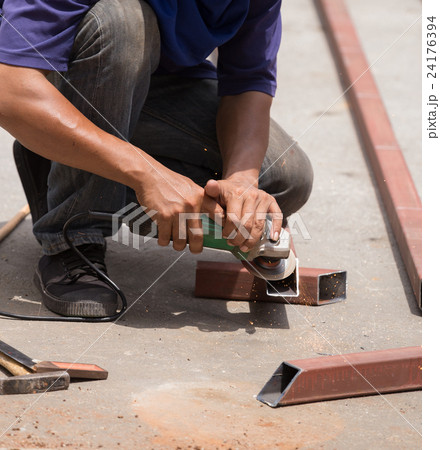 worker using grinder to grinding metal worker using grinder to grinding metal 24176394