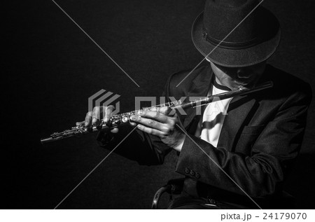 Flute music playing flutist musician performer on black background, musical instrument 24179070