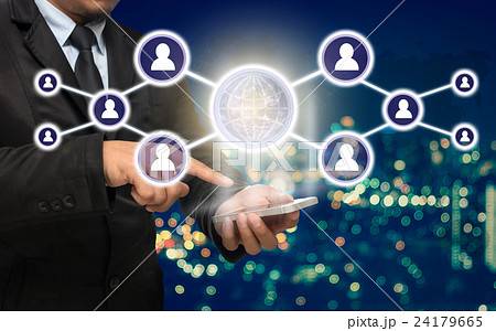 Businessman using the smart phone with the Social media symbol on Blurred Photo bokeh of cityscape, Elements of this image furnished by NASA, Business network concept Businessman using the smart phone with the Social media symbol on Blurred Photo bokeh of cityscape, Elements of this image furnished by NASA, Business network concept 24179665