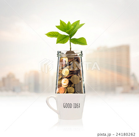 Gold coins and seed in clear bottle over the glass with text good idea on photo blurred cityscape background,Business investment growth concept Gold coins and seed in clear bottle over the glass with text good idea on photo blurred cityscape background,Business investment growth concept 24180262